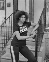 A Mother in Front of her House