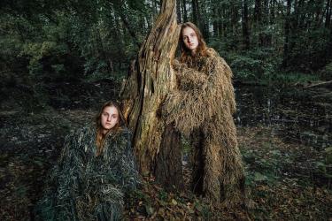 Two Sisters Near a Tree